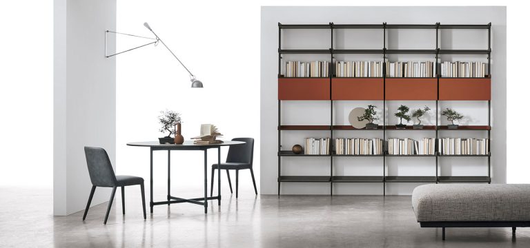 Modern minimalist living room with bookshelf and dining set